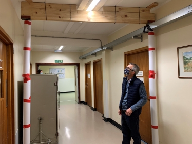 James inspecting props holding up roof at QEH